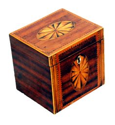 an old wooden box with a dart in it