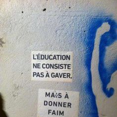 some stickers on the side of a wall that says education ne consisite pass a gavr