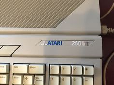 a computer keyboard with the word atari on it