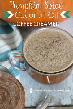 pumpkin spice coconut oil coffee creamer in a glass mug on a towel with a spoon