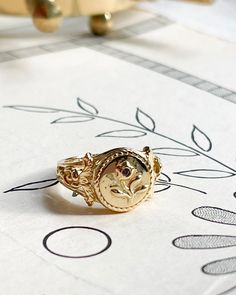 Posy Locket Ring – Bijou Limon Anniversary Jewelry Ring With Flower Charm, Gold Oval Ring With Birth Flower Detail, Gold Oval Birth Flower Ring, Gold Oval Ring With Birth Flower, Gold Oval Ring With Birth Flower Design, Heirloom Birth Flower Jewelry, Gold Promise Jewelry With Birth Flower, Vintage Gold Flower Ring In Sterling Silver, Gold Heirloom Signet Ring With Birthstone