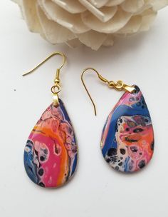 Handmade Earrings Sculpey Clay  Resin sealed  2.5 inches tall Gold hypoallergenic wires Set of rubber backings included  Beautiful piece of jewlery for any occasion No harsh chemicals to clean!! If piece gets scratched, you can use a resin polish Multicolor Hypoallergenic Teardrop Earrings As Gift, Unique Adjustable Teardrop Earrings With Ear Wire, Multicolor Drop Earrings As Gift, Multicolor Drop Earrings For Gift, Multicolor Cadmium-free Earrings For Gift, Artistic Teardrop Earrings For Jewelry Making, Cadmium-free Teardrop Earrings As Gift, Artsy Teardrop Jewelry With Matching Earrings, Hypoallergenic Multicolor Drop Earrings