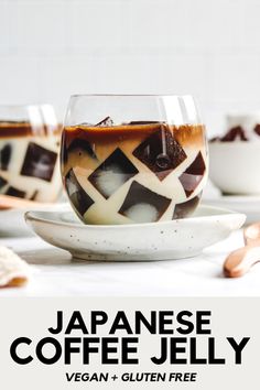 japanese coffee jelly in a glass bowl with spoons on the side and another cup next to it