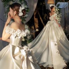 a woman in a wedding dress standing next to another woman wearing a flowered gown