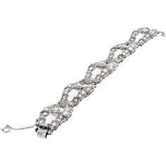 Revel in the realm of exquisite artisanship and unparalleled beauty with the Platinum 20 Carats Old Mine Open Link Bracelet from . This bracelet is a testament to timeless elegance, featuring 20 carats of old mine cut diamonds set in a delicate and sophisticated open link design. Crafted from luxurious platinum, this vintage-inspired piece exudes charm and grace, making it a must-have addition to any fine jewelry collection.The bracelet's length of 6.5 inches ensures a comfortable fit, while the intricate detailing and craftsmanship showcase its exceptional quality. Each diamond is carefully selected for its brilliance and fire, adding a captivating sparkle to your ensemble. Whether worn alone as a statement piece or layered with other bracelets for a more dramatic look, this bracelet effo Vintage Diamond Bracelet With Brilliant Cut For Formal Occasions, Vintage Platinum Diamond Bracelet With Single Cut Diamonds, Classic Diamond Bracelet For Evening, Exquisite Diamond Cut Platinum Bracelet, Exquisite Platinum Diamond Cut Bracelet, Exquisite Platinum Diamond Bracelet With Single Cut Diamonds, Art Deco Platinum Diamond Wedding Bracelet, Art Deco White Gold Diamond Cut Bracelet, Platinum Diamond Bracelet With Single Cut Diamonds For Wedding