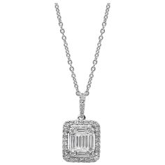 Showcasing baguette diamonds connected to look like a single large emerald cut diamond. Center diamond is surrounded by a diamond halo on an accented bale. Diamonds weigh 0.84 carats total. Suspended on an 18 karat white gold chain. Roman Malakov is a custom house, specializing in creating anything you can imagine. If you would like to receive a special quote on a custom piece please message or call us. Formal Emerald Cut Diamond Necklace, Emerald Cut Diamond White Diamond Necklace, Formal Emerald Cut Diamond Necklace With Diamond Accents, Emerald Cut Diamond Necklace With Accents For Formal Events, Formal Emerald Cut Diamond Necklace With Accents, Emerald Cut Baguette Diamond Necklace For Anniversary, Emerald Cut Diamond Necklace With Baguette Diamonds For Anniversary, Anniversary Emerald-cut Diamond Necklace With Baguettes, Emerald Cut Diamond Necklace In Diamond White