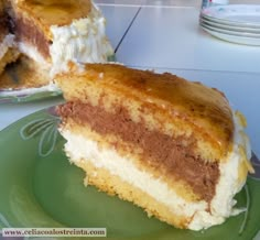 a piece of cake sitting on top of a green plate next to a slice of cake