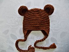 a crocheted brown bear hat with ears