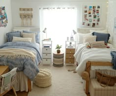 a bedroom with two twin beds and pictures on the wall above them, along with other furniture