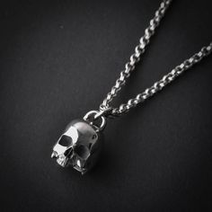 A handmade sterling silver 925 large half skull necklace.Chain Lenght: 80cm (if you would like a different length please state so in "note to seller".)Skull Measurements: Skull Hight-Approx 21.18mm | Skull Width-Approx 14.6mmApprox Weight: 30grChain Thickness: 3mmThe necklace is made of sterling silver 925 and is water resistant.Here are some listings that you might also love:https://www.etsy.com/il-en/listing/528256264/skull-cuff-bracelet-skull-bracelet-skullhttps://www.etsy.com/il-en/listing/5 Handmade Silver Necklace With Skull Shape, Silver Oxidized Skull Necklace, Skeleton Jewelry, Skeleton Necklace, Half Skull, Handmade Skulls, Skull Bracelet, Skull Necklace, Skull Pendant