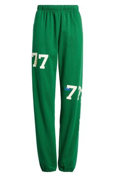 Number graphics lend varsity style to lounge-ready sweatpants cut from a breathable cotton blend. 32" inseam; 12" leg opening; 13" front rise; 16" back rise (size Large/X-Large) Elastic waist Side-seam pockets Elastic cuffs 84% cotton, 16% polyester Machine wash, line dry Imported Sportswear Sweatpants With Letter Print For Loungewear, Sporty Letter Print Sweatpants For Loungewear, Sporty Sweatpants With Letter Print For Loungewear, Casual Green Sweatpants With Letter Print, Graphic Print Sweatpants For Spring Loungewear, Green Cotton Sweatpants With Letter Print, Green Letter Print Cotton Sweatpants, Spring Graphic Print Sweatpants For Loungewear, Cotton Athleisure Sweats For Sports Season