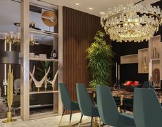 a dining room table with blue chairs and a chandelier