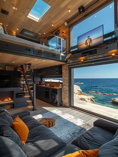 a living room with large windows overlooking the ocean