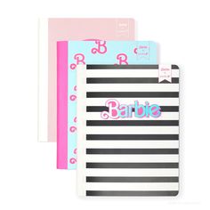 three notebooks with black and white stripes, one has pink letters on the front