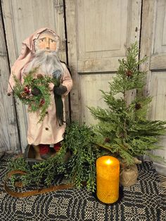 Primitive Santa Holding Wreath with Clay Face Primitive Santa Patterns, Primitive Ornaments, Primitive Christmas Decorating, Primitive Christmas Decor, Wood Ceiling Lights, Primitive Wood Signs, Primitive Lighting, Primitive Candles, Primitive Walls