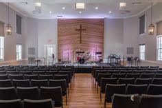 an empty church filled with black chairs