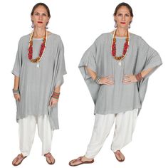 Austria Moroccan Cotton Poncho Tunic Top • Bust - Hips 94" • Sleeve width 22"• Length 30"-33" Our best-selling generously designed over-size tunic top. Everyone, love the Mirage Poncho that is so flattering to all figures. Because hand-woven Moroccan Cotton sousdie is like jersey knit (remember those fabulous 1940's dresses?) it drapes like a dream. So wear it loose like the model or belted for a more ethnic look. Soft, luxurious and a goodly weight- that's why we call it the Cashmere of cotton! Oversized Short Sleeve Poncho, Casual Flowy Tunic For Loungewear, Flowy Casual Tunic For Loungewear, Oversized Summer Poncho For Layering, Oversized Poncho For Summer Layering, Oversized Tunic For Layering, Oversized Batwing Sleeve Tops For Vacation, Relaxed Fit Lagenlook Blouse For Beach, Lagenlook Tunic Blouse Relaxed Fit