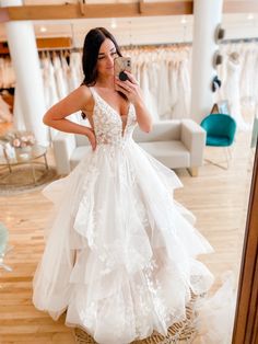 a woman taking a selfie in her wedding dress