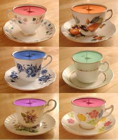 six tea cups and saucers with different designs on them, all in different colors