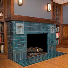 a fireplace in a library with books on the shelves