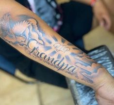 a person with a tattoo on their arm