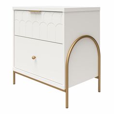 a white dresser with gold handles on it