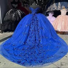 Make your quinceanera an unforgettable celebration of beauty and elegance with this stunning off-the-shoulder royal blue dress. The dress is crafted from delicate tulle, creating a timeless, princess-inspired look, while the chapel-train adds a dramatic, regal touch. The off-the-shoulder neckline exudes classic sophistication, and the sleeveless design enhances the graceful flow of the gown. The intricate applique detailing on the bodice and skirt elevates the dress, creating a harmonious blend Royal Blue Quince Dress, Quince Blue, Blue Quince Dress, 15 Birthday Dresses, Baby Blue Quinceanera, Royal Blue Ball Gown, Royal Blue Quinceanera Dresses, Blue Quinceanera Dresses, Blue Wedding Dress Royal