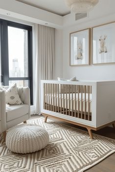 a baby's room with a white crib and large windows