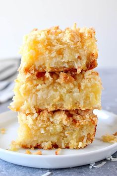 three pieces of cake sitting on top of a white plate