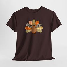 A unisex heavy cotton tee featuring a picture of a turkey made with patchwork. This tee gives off a cozy and relaxed vibe, perfect for Thanksgiving celebrations or casual everyday wear. Ideal for those who love unique and festive designs. Product features - Shoulder tape for stability - Ribbed knit collar for elasticity - Made with strong and smooth fabric - Classic fit for comfort - Ethically grown and harvested US cotton Care instructions - Machine wash: warm (max 40C or 105F) - Non-chlorine: bleach as needed - Tumble dry: medium - Do not iron - Do not dryclean Turkey Lover, Holiday Apparel, Thanksgiving Celebration, Fall Tee, Thanksgiving Shirt, Thanksgiving Shirts, Casual Everyday, Knit Collar, Holiday Outfits