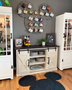 a mickey mouse themed room with plates and cups