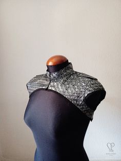 This bolero jacket is limited edition and made to order! Size 36 is ready to ship -please check the pictures to see the size chart for guidance. This garment is made of silver pleather with engraved stars, and black cotton lining. It's finished on the edges with with black cotton bias tape, and features ornamental studded straps on the shoulders. * SIZE INFO * Please check the size chart in the pictures for guidance. Size 36 is ready to ship. Get back to my Etsy shop to see more items - www.mpar Fitted Alternative Costume Outerwear, Alternative Fitted Costume Outerwear, Steampunk Fitted Outerwear For Festivals, Fitted Steampunk Party Outerwear, Fitted Punk Outerwear For Festivals, Punk Style Fitted Outerwear For Festivals, Fitted Futuristic Black Outerwear, Armor Jewelry, Goth Steampunk