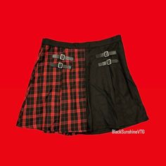 Split black and plaid skirt with side buckles Please review images for measurements and other details Black Cosplay Skirt For Fall, Black Punk Skirt For School, Black Punk Mini Skirt For School, Black Grunge Mini Skirt For Fall, Red Punk Skirt For Fall, Black Grunge Skirt For Fall, Fall Rock Style Skirt For Cosplay, Punk Style Fitted Skirt For School, Punk Fitted Skirt For School