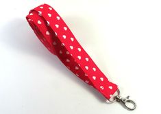 This cute lanyard has beautiful heart polka dots on red. It is perfect for any occasion. You can leave me a convoy if you need a different size. You can have a wardrobe of lanyard to match your outfit. This lanyard is made of soft 100% cotton fabric to give a comfortable feel around your neck. This lanyard is easy to take care. You can spot clean and throw in a washer and hang dry. If you want you can iron and it is ready to use. These lanyards are perfect if you have metal allergy. Each of thes Adjustable Red Lanyard As Gift, Red Lanyards With Key Leash For Gifts, Red Lanyard With Key Leash As Gift, Dot Heart, Cute Lanyards, Patriotic Fabric, Fabric Lanyard, Have Metal, Beautiful Heart