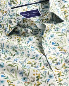 100% cotton, Available in classic and slim fit, Made with Liberty fabric, made in Italy, Exclusively designed for CT, Semi-spread collar, Rounded button cuff with one button, Classic and slim fit: back pleats, Machine washable - Made with Liberty Fabric Semi-Cutaway Collar Floral Print Shirt - Multi | Men's Charles Tyrwhitt Made With Liberty Fabric Semi-Cutaway Collar Floral Print Casual Shirt Size Large Cotton Fitted Cotton Dress Shirt With Casual Collar, Formal Cotton Shirt With Floral Print, White Floral Print Shirt For Formal Occasions, Classic Collared Tops With Floral Print, Classic Collared Top With Floral Print, Classic Fitted Collared Tops, Classic Button-up Shirt With Floral Print, Classic Floral Print Button-up Shirt, Spring Dress Shirt With Spread Collar And Button Closure