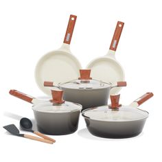 an assortment of pots and pans with wooden handles