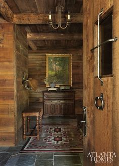 an entry way with wooden walls and tile flooring