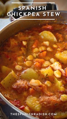 spanish chickpea stew with potatoes and carrots in a pot