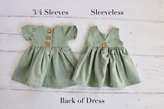 2-3 WEEK TURNAROUND TIME. This light green, seafoam cotton/linen handmade dress is the perfect addition to any little's wardrobe! Though great for all year cuteness! Perfect fall and winter with elbow length sleeves. Or summertime fun with the tank version. Dress is a elbow-sleeved or sleeveless, with a lined, slightly curved front bodice. Three wooden button closures in the back of the dress of the 3/4 sleeved version. Tank version has a V-back and 1 button. This fabric is a linen cotton blend, Cute Cotton Button-up Dress, Cute Button-up Cotton Dresses, Cute Button-up Summer Dresses, Cute Summer Button-up Dresses, Cute Short Sleeve Dress With Button Closure, Green Buttoned Dress For The Beach, Green Buttoned Dress For Beach, Green Buttoned Beach Dress, Cute Fitted Button-up Dress