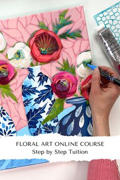 a woman is painting flowers on a canvas with watercolors and crayons