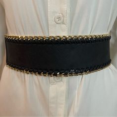 Black Faux Leather Elastic Waistband Gold Tone Braided Chain Belt Color: Black, Gold Tone Material: 50% Faux Leather, 50% Elastic Please Notice: White Shirt Is Not Included, Listing Is For The Belt Only. Warning: P65 (See Last Picture) All Measurements Are Approximate And Taken Laying Flat: Length: 29 Inches Width: 2 1/2 Inches Tags For Exposure: Chunky Black Gold Black Belt Waist Belt Western Wide Location: Tote: #2 Chic Black Chain Link Belt, Black Chain Belt With Chain Strap For Evening, Adjustable Black Chain Belt With Chain Strap, Adjustable Black Chain Belt, Adjustable Black Metal Chain Belt, Black Chain Belt For Night Out, Chic Black Adjustable Chain Belt, Edgy Black Metal Chain Belt, Chic Black Chain Belt For Party