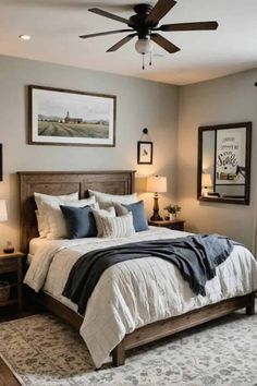 a bedroom with a bed, ceiling fan and pictures on the wall