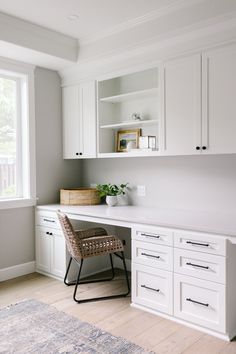 a white desk and chair in a room