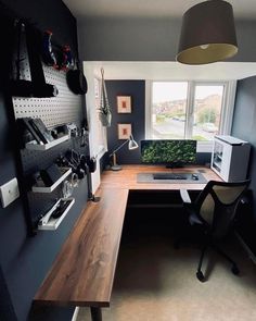 a home office with a desk and chair in the corner, next to a radiator