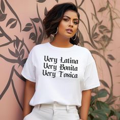 Embrace your Latina identity with the Very Latina, Very Bonita, Very Toxica t-shirt for women. This shirt is perfect for those who take pride in their Hispanic heritage and want to showcase their unique personality. The design captures the essence of a strong, confident Latina with a touch of humor, making it a standout piece in any wardrobe. Ideal for a Latina girlfriend, a fashion-forward latinx chicana, or any woman who appreciates a blend of style and cultural pride. Celebrate Hispanic cultu Hispanic Women Fashion, Mexican Shirt, Hispanic Culture, Mexican Shirts, Hispanic Heritage, Girlfriend Gift, Urban Style, T Shirt For Women, Shirt For Women