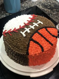 a football cake with orange and brown frosting