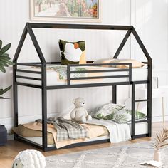 a black metal bunk bed sitting on top of a hard wood floor next to a white rug