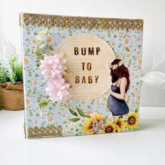 there is a card that says bump to baby with flowers on the front and bottom