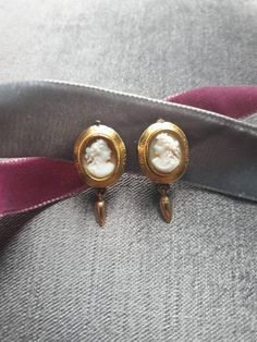 Lovely pair of antique Victorian hand carved shell cameo clip on earrings depicting lady's head profile, cameo set in yellow gold tested 585 ct. Cameo in decorative gold frame from the late 1800. Clip mechanism is of later addition, yellow gold stamped 333 ct. Measurments: 2 x 1.5 cm. Weight  6.0 g. Victorian Clip On Earrings, Victorian Yellow Gold Clip-on Earrings For Formal Events, Antique Yellow Gold Cabochon Earrings, Antique Wedding Cabochon Earrings, Gold Cameo Earrings For Wedding, Victorian Gold Cabochon Earrings, Victorian Cameo Yellow Gold Earrings, Antique Clip-on Yellow Gold Earrings, Classic Cameo Earrings For Wedding