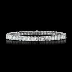 Emerald straight line diamond bracelet.  Item Details * Total Diamond Weight:  18.72 Ctw. * Diamond Color-Clarity: H Color VS - Si Clarity * Diamond Shape: Emeralds * Number of Emeralds: 48 ( 0.39ctw each) * Setting Type: Classic Prong setting. * Gold Kt: 18K White Gold. * Total Gold Weight:  20.08 Grams * Clasp Type: Box catch with hidden safety * Custom Gold Color: Rose Gold, Yellow Gold, White Gold, Platinum  * Made to Order.  * Ready to Ship in 7 Working Days Services * Free change of Finger Sizing * Free Polish  * Appraisal Value Certificate (Charges Applicable) Luxury Platinum Diamond Bracelet With Baguette Diamonds, Elegant Diamond Bracelet With Emerald Cut Single Diamonds, Elegant Diamond Bracelet With Single Cut Emerald Shape, Diamond White Platinum Bracelet With Baguette Diamonds, Platinum Diamond Bracelet With Baguette Diamonds In Diamond White, Luxury Emerald Cut Diamond Tennis Bracelet, Luxury Diamond Tennis Bracelet With Baguette Cut, Luxury Diamond Tennis Bracelet Baguette Cut, Formal Emerald Cut Diamond Bracelet With Single Cut Diamonds